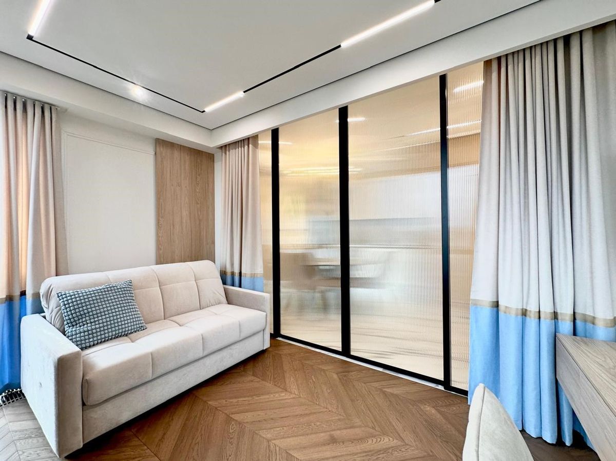 Spacious living room with convertible sofa